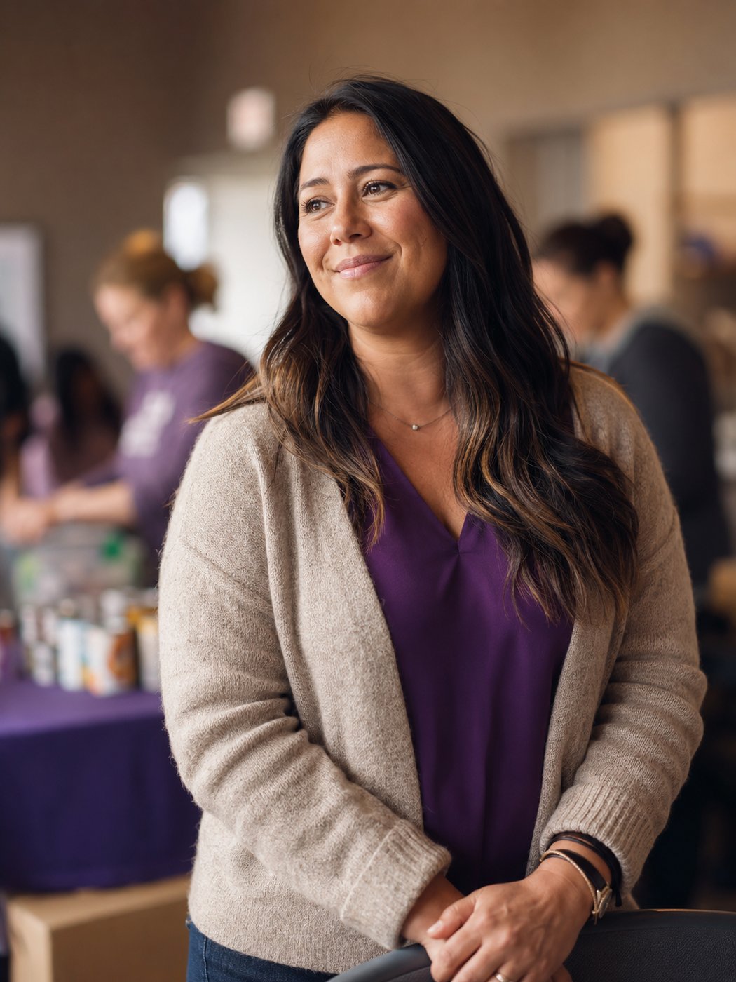 A confident nonprofit director or program lead in a warm community setting